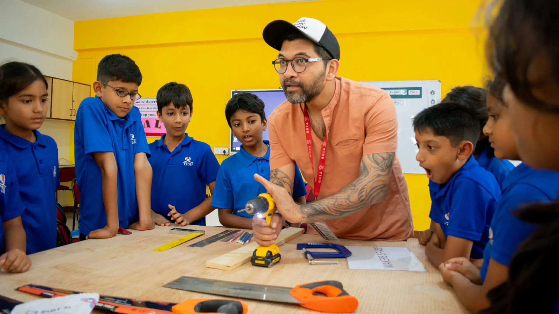 tisb out side the classroom after school activities banner